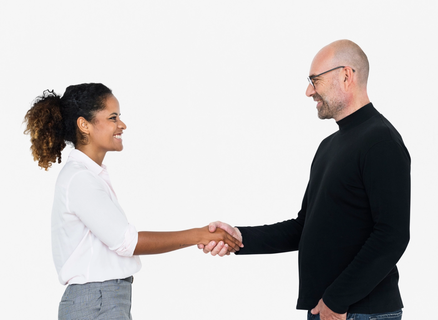 A young lady from the creative agency shaking hands with a client in agreement to partnering together to make their brand better