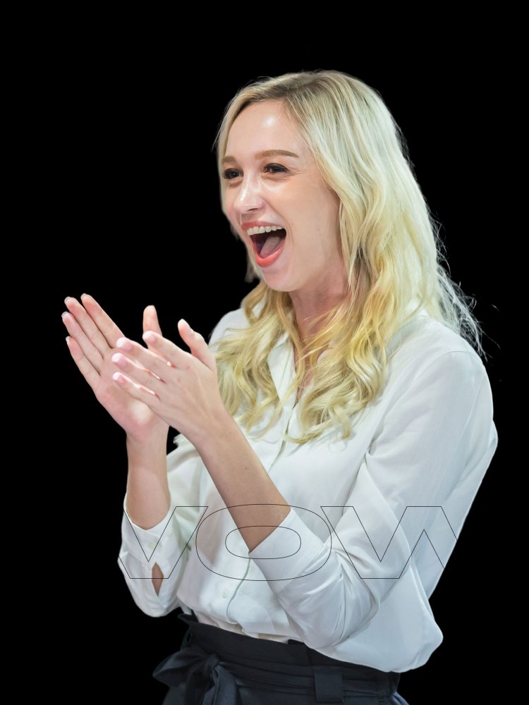 A happy client applauding the successful results delivered by our creative agency.